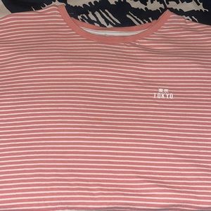Men’s Large pink and white striped T-shirt with “TOKYO” logo on left chest.